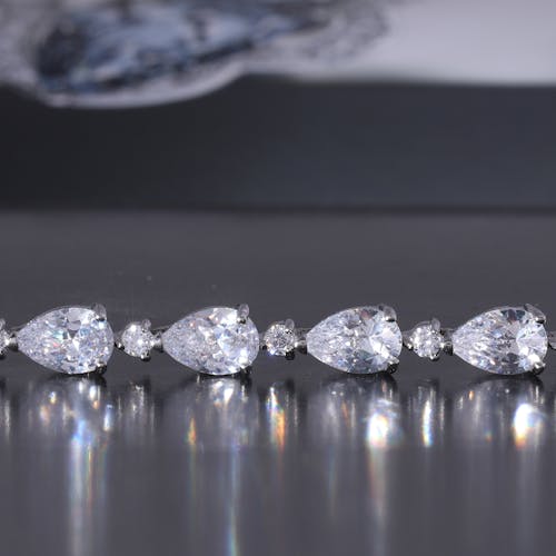 Diamonds on Silver Setting on a Flat Surface