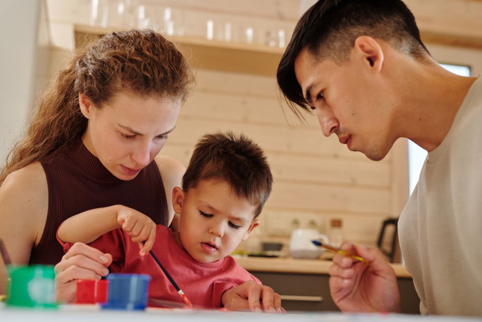 Photo by Werner Pfennig on Pexels A family spends quality time painting together indoors, fostering creativity and connection. - Photo by Werner Pfennig on Pexels