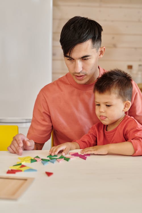 Free Father and Son Sitting at the Table Stock Photo
