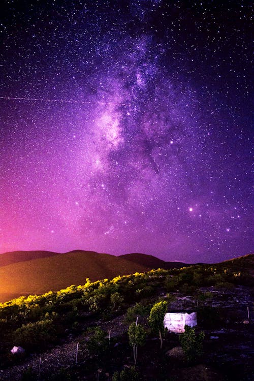 View Of Countryside Under Evening Purple Sky