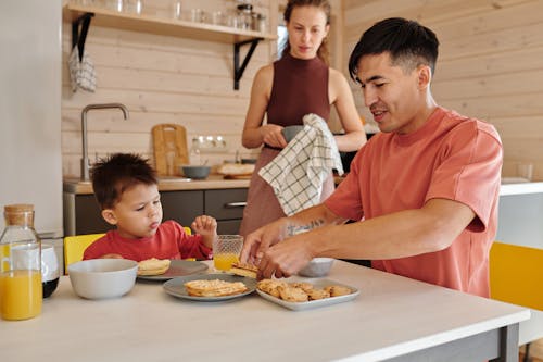Free A Family Eating at the Table Stock Photo