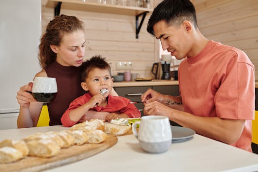 A family enjoys a cozy breakfast together, bonding over food and coffee in their kitchen.