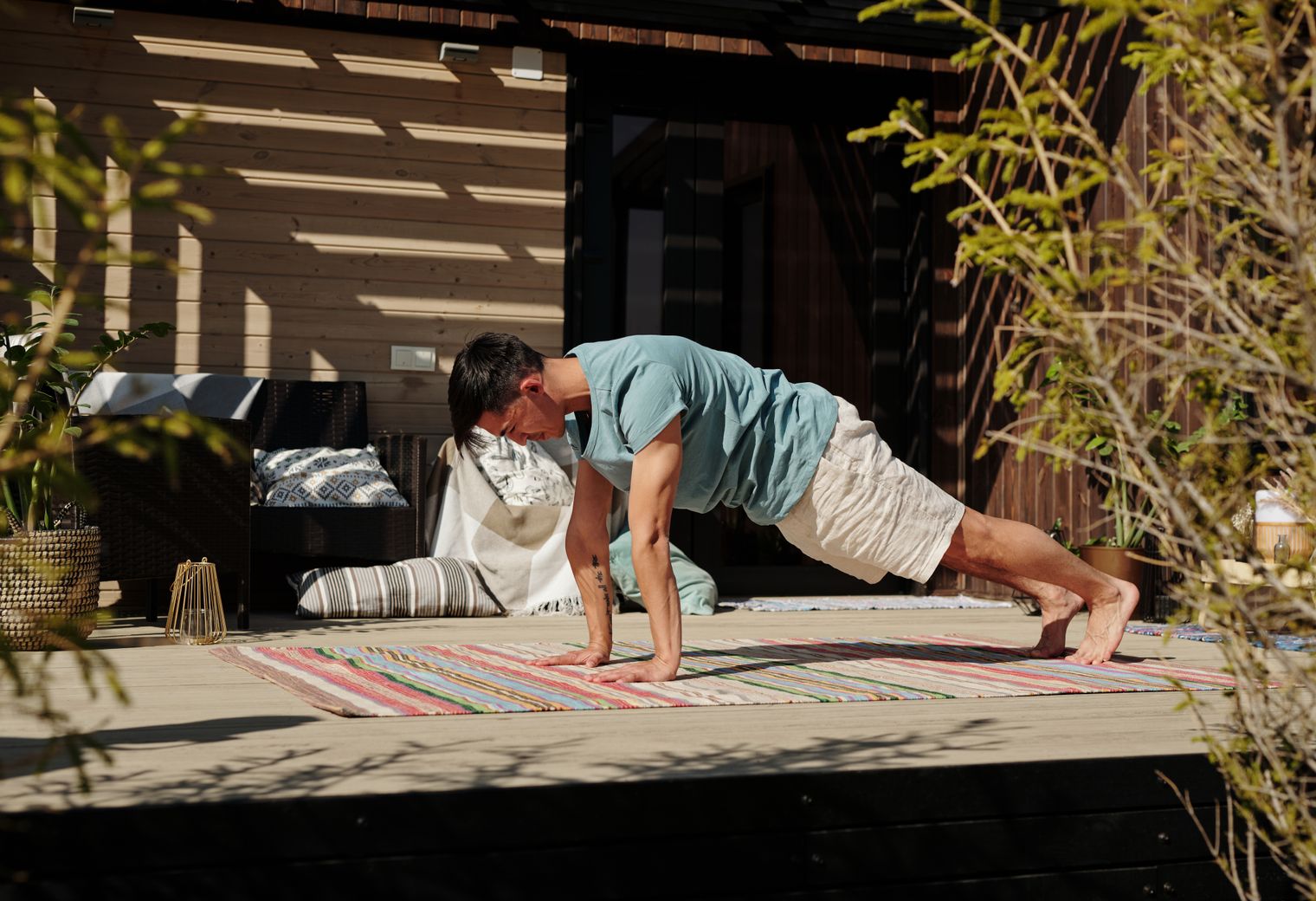 Fence and Decking Painting in Edgware — careful masking before painting begins