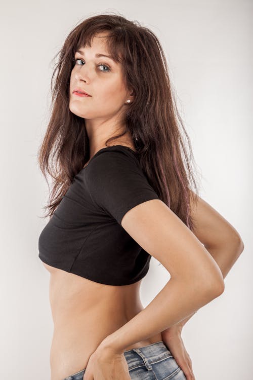 Woman in Black Crop Top Posing Sexily at the Camera
