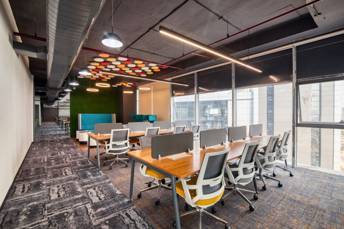 Modern open office interior with desks and chairs