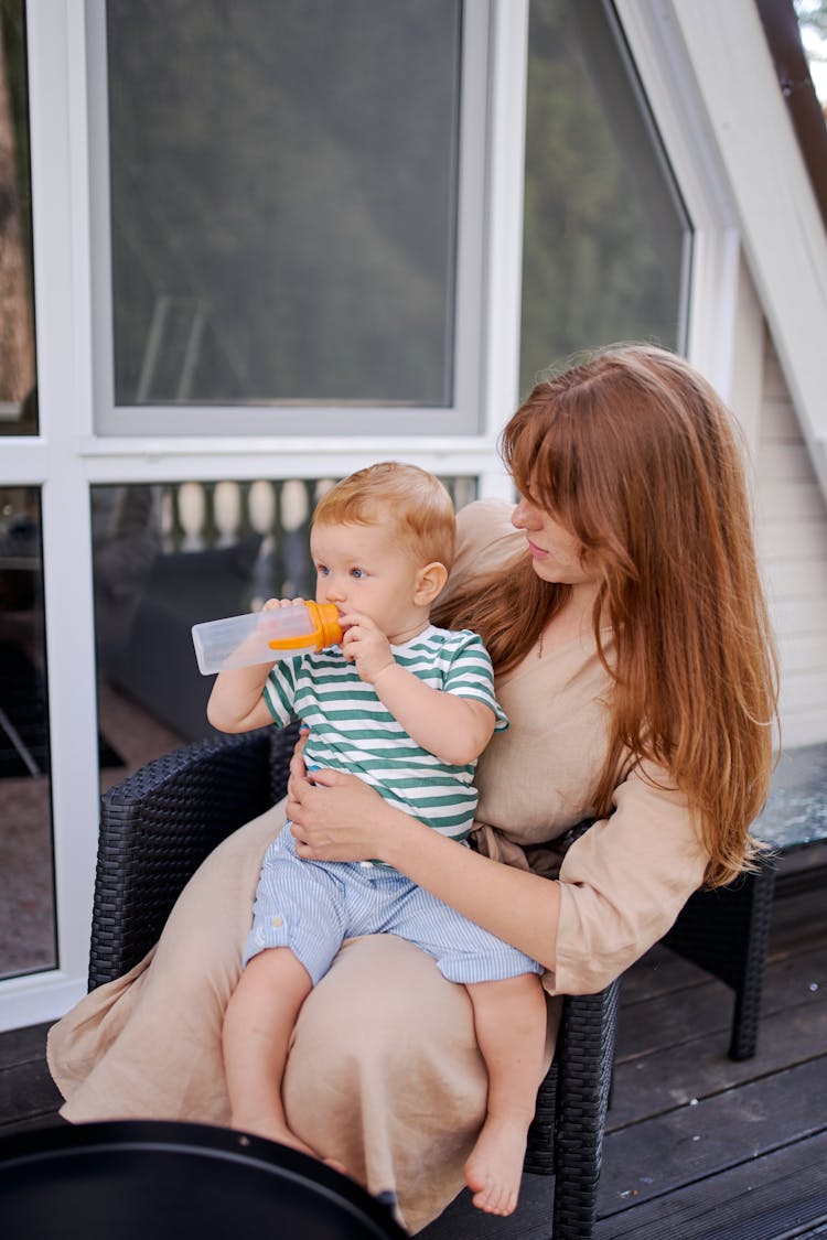 Mother With Son On Lap In Armchair