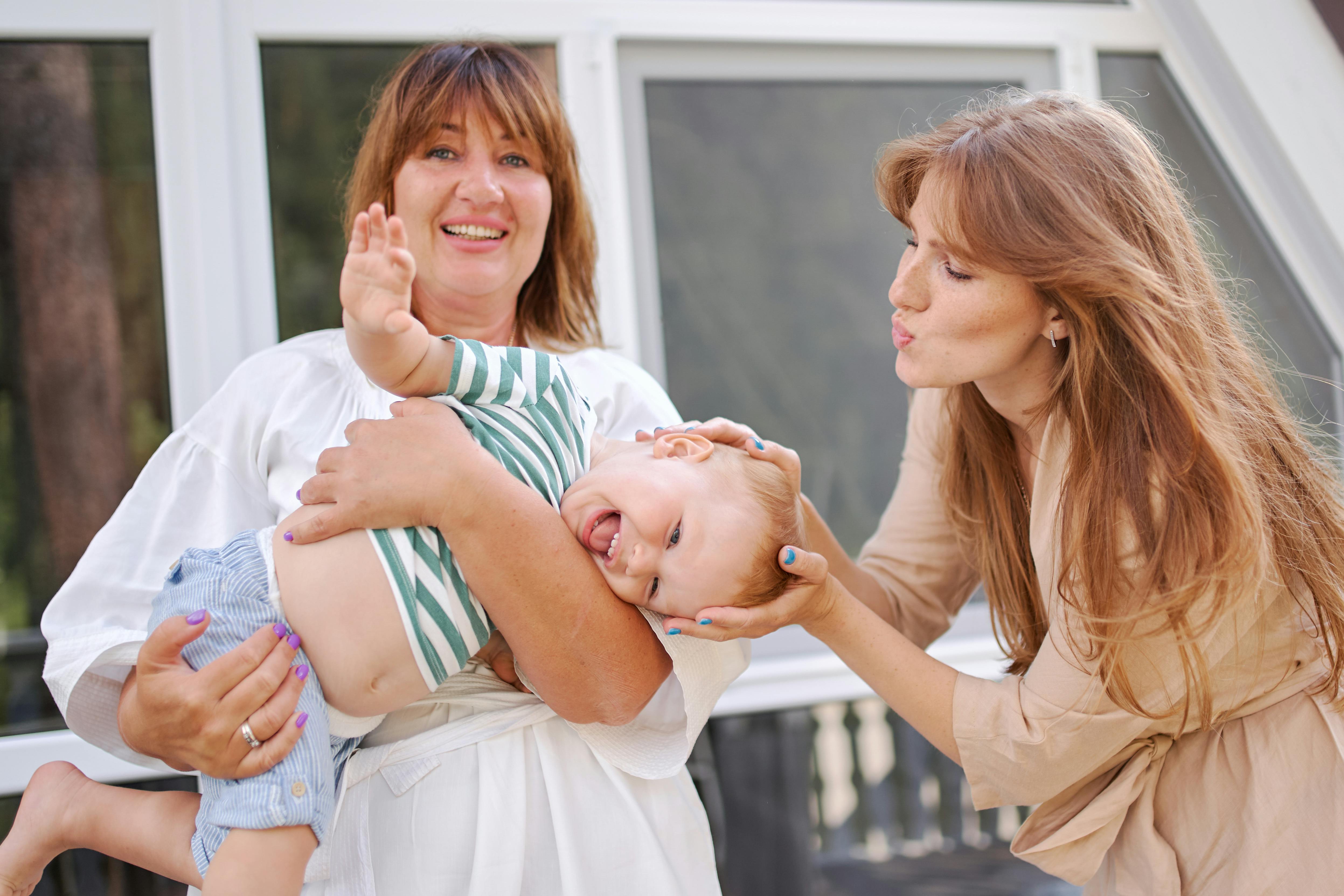 grandmother and mom with little boy