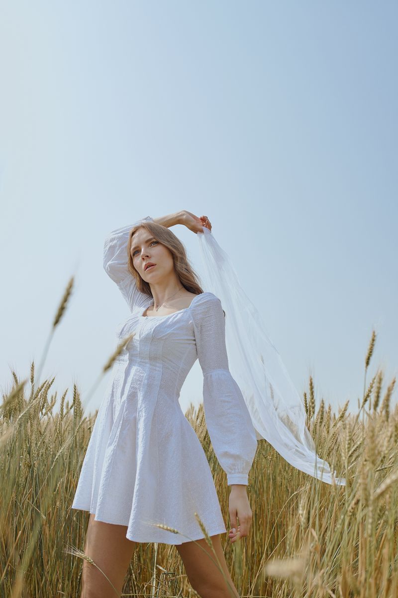 woman in a white summer linen dress