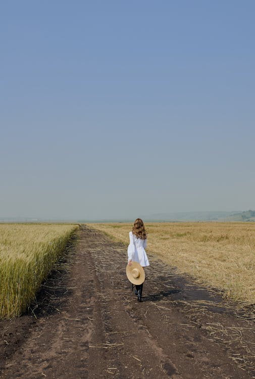 Woman In White Dress Walking