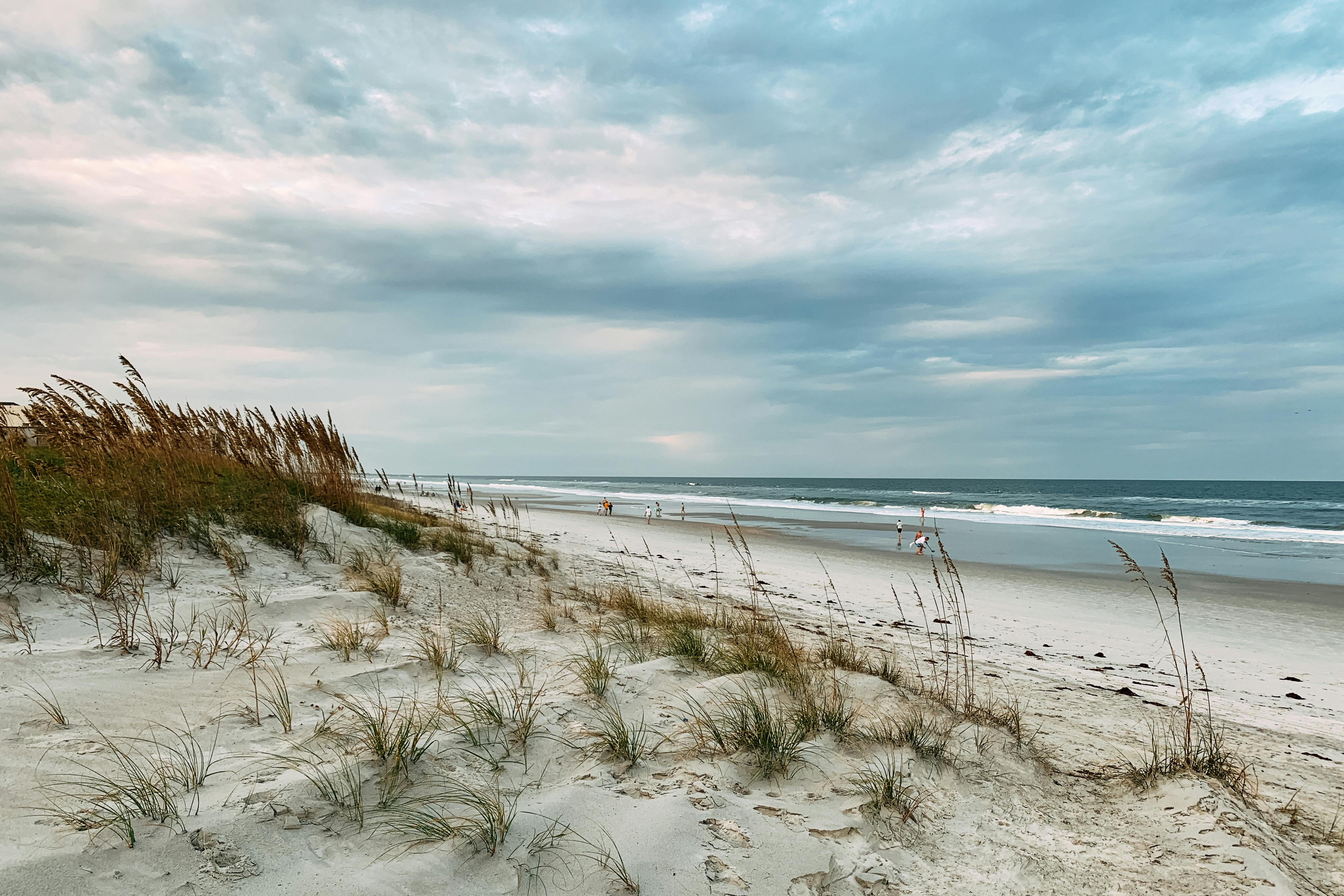 A tranquil seascape with dunes and ocean waves at Jacksonville Beach, FL.