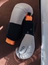 Boxing gloves placed on textured surface