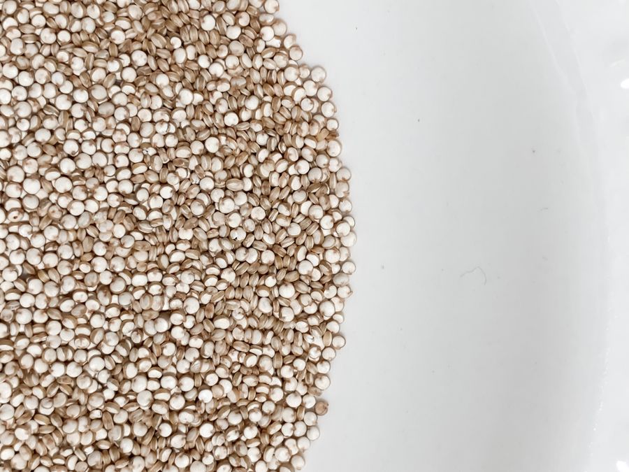 Quinoa seeds arranged on a light surface