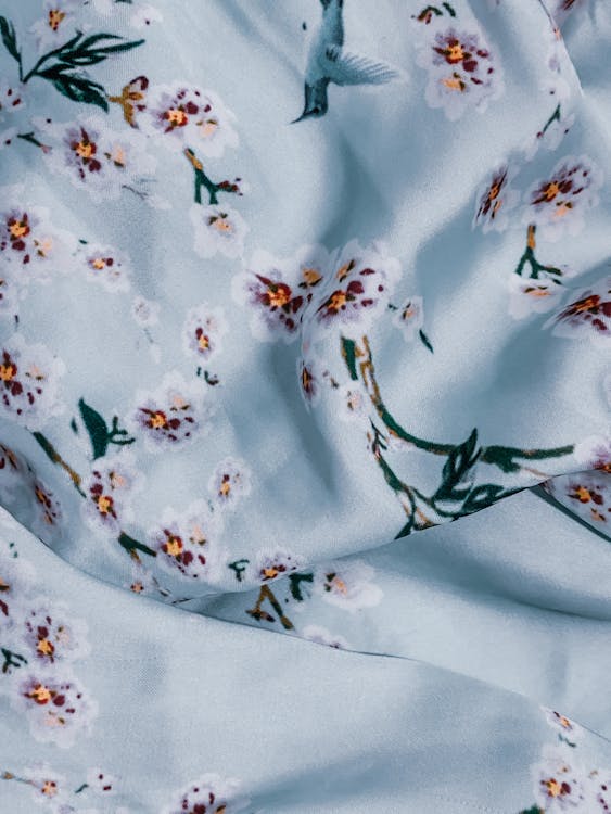 Satin crumpled fabric with flowers and birds