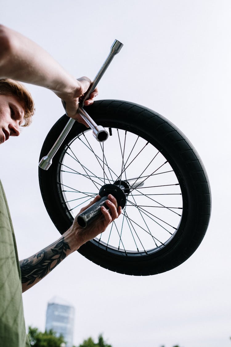 Man Fixing A Tire 