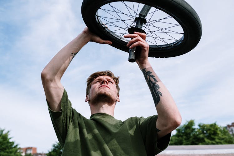 Man Fixing A Tire