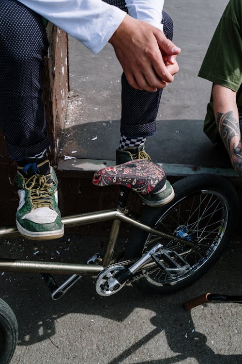 A Person in Green Sneakers