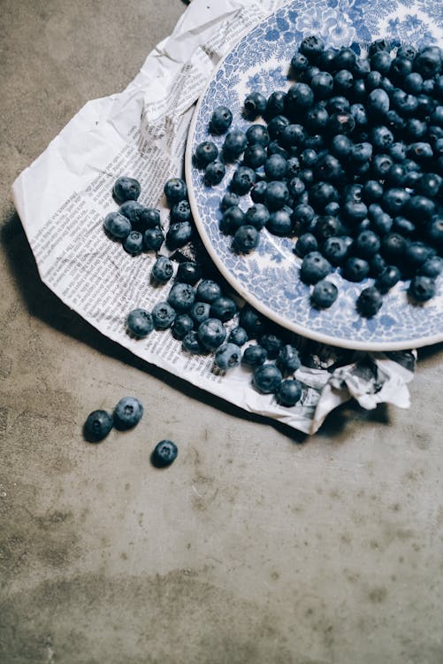 blueberries scattered on a plate