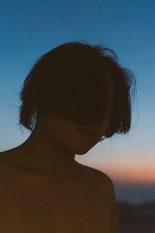 Free Moody silhouette portrait of a person at sunset in Ho Chi Minh City, Vietnam. Stock Photo