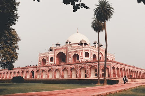Facade of famous medieval building named Humayun Tomb located in Delhi in India in summer day under cloudless gray sky