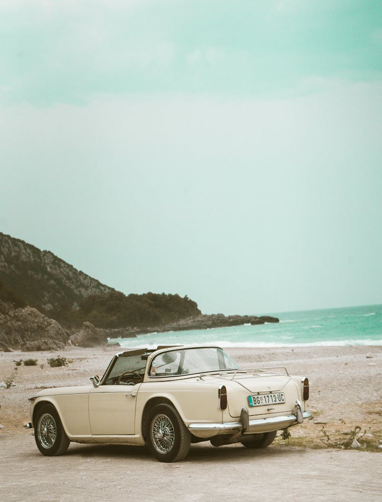 Vintage White Car By The Beach