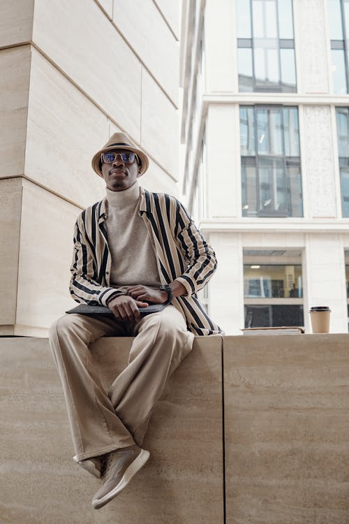 Male Fashion Designer Sitting on a Platform