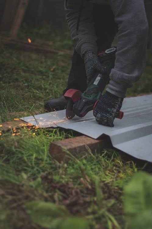 A Person Using an Angle Grinder