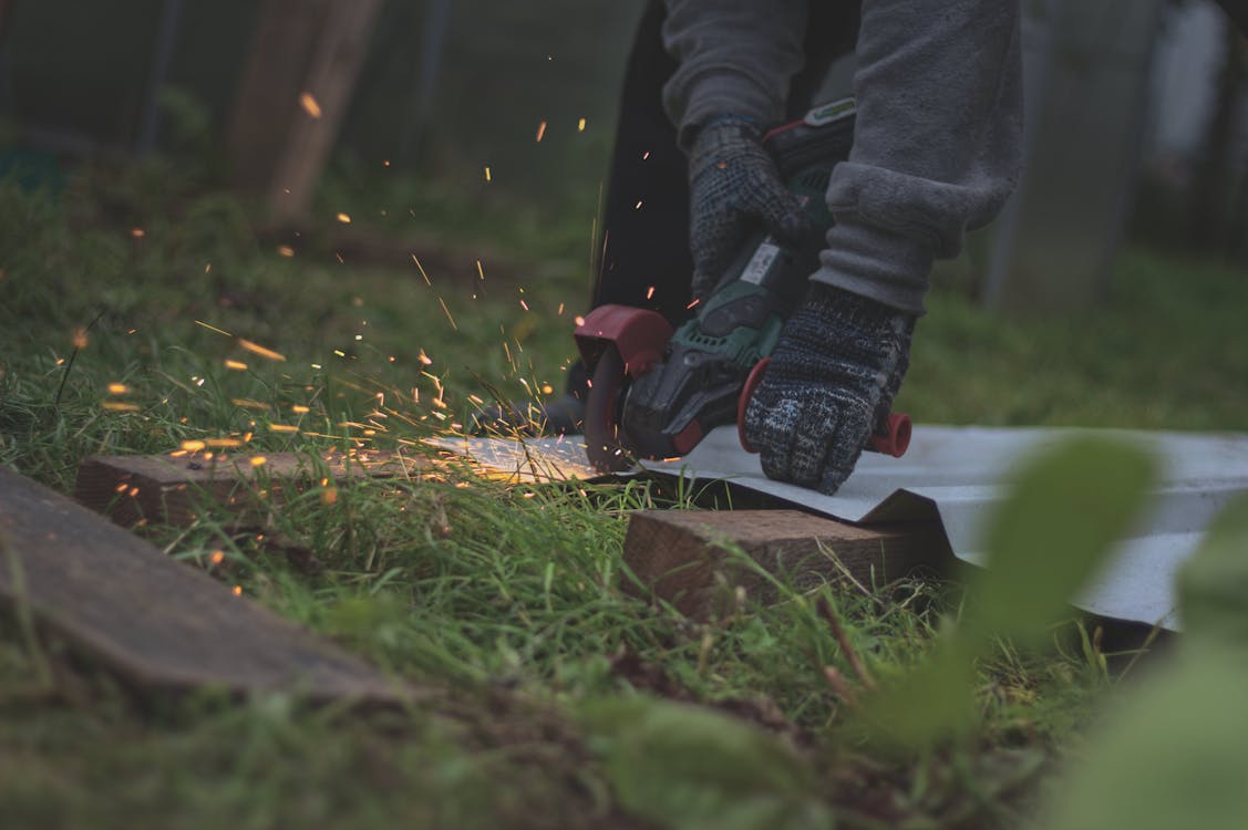 A Person Using an Angle Grinder