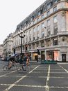 Man in Black Jacket Riding Bicycle on Pedestrian Lane