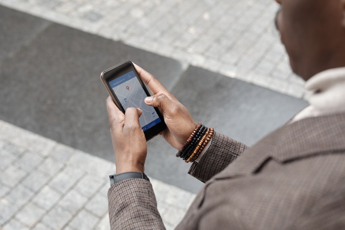 Traveller checking changed flight details on a phone
