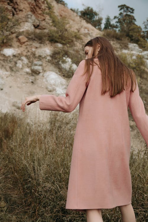 Back View of a Woman in a Pink Outfit