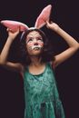 Woman in Green Tank Top Holding Pink Heart Shaped Pillow