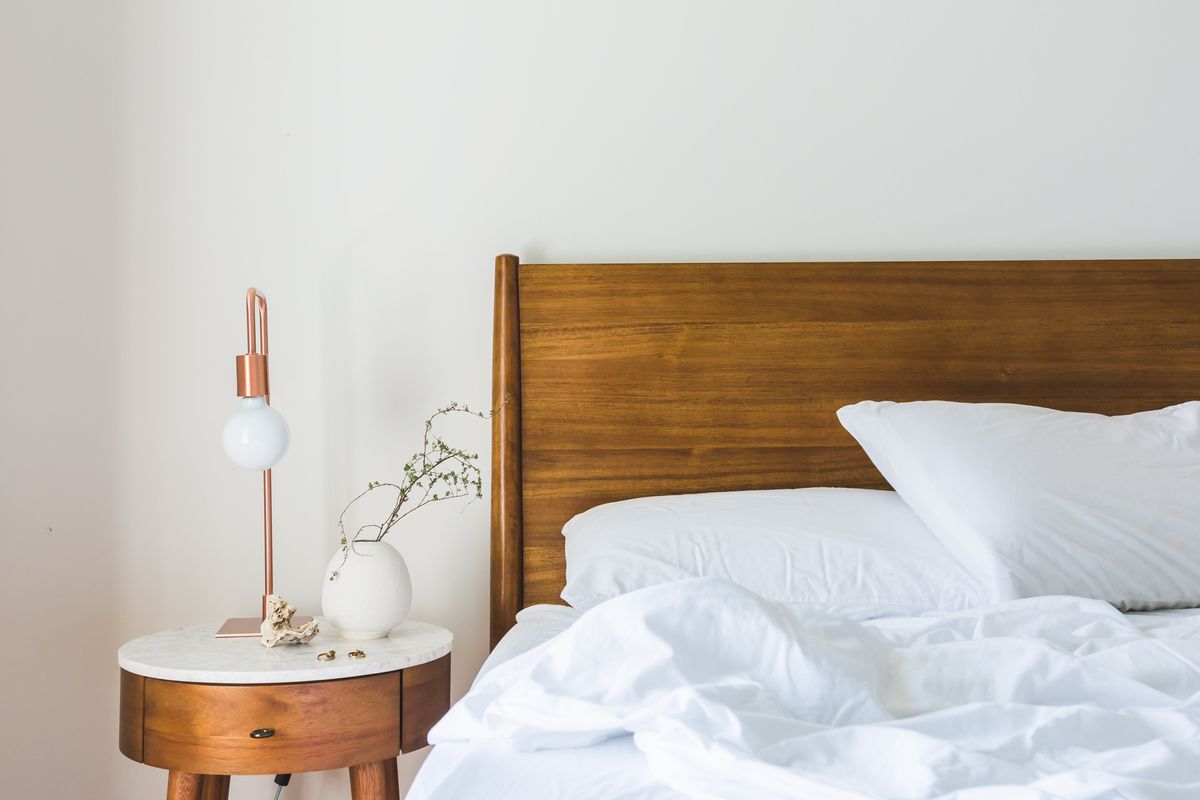 Plump pillow on a warm cream bedspread