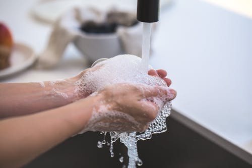 Person Washing His Hand