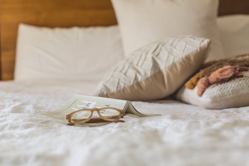 Eyeglasses With Brown Frames on White Textile