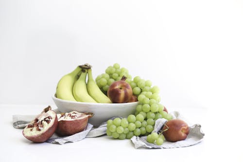 Grapes and Bananas in White Bowl