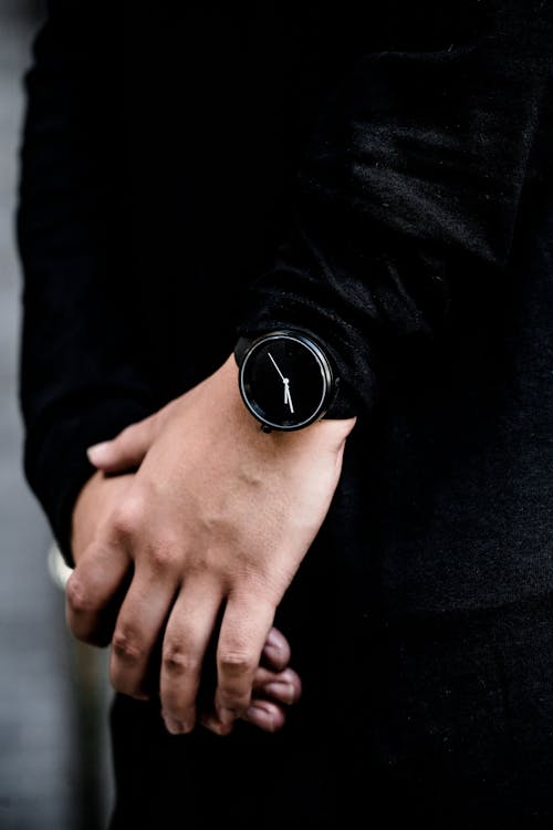 Person Wearing Black Analog Watch