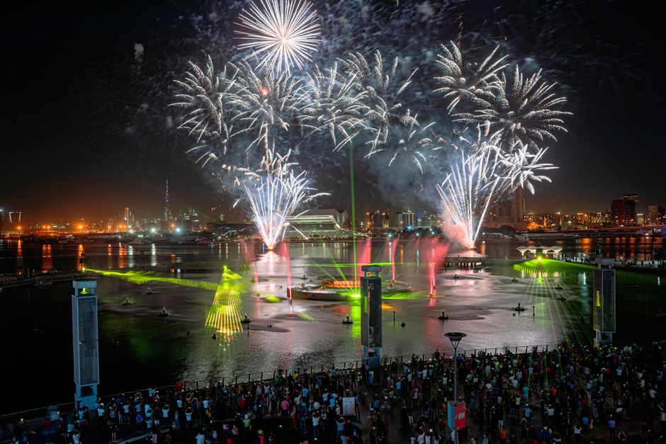 The Dubai Fountain show with Burj Khalifa illuminated in the background
