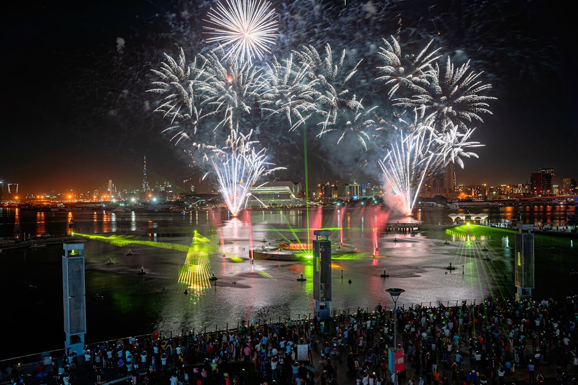 People Watching Fireworks Display during Nighttime