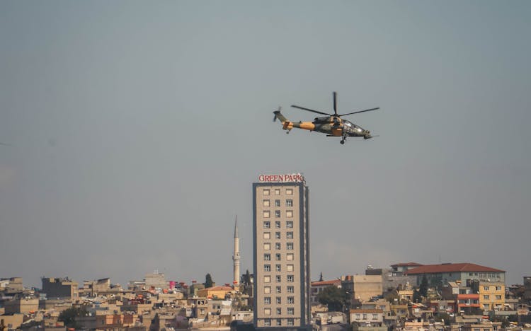 Helicopter Flying Over City