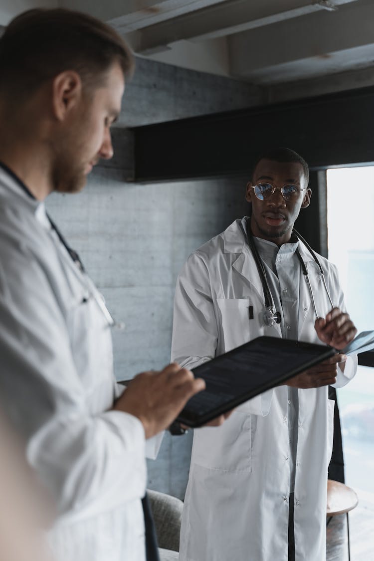 Doctors Standing With Tablet