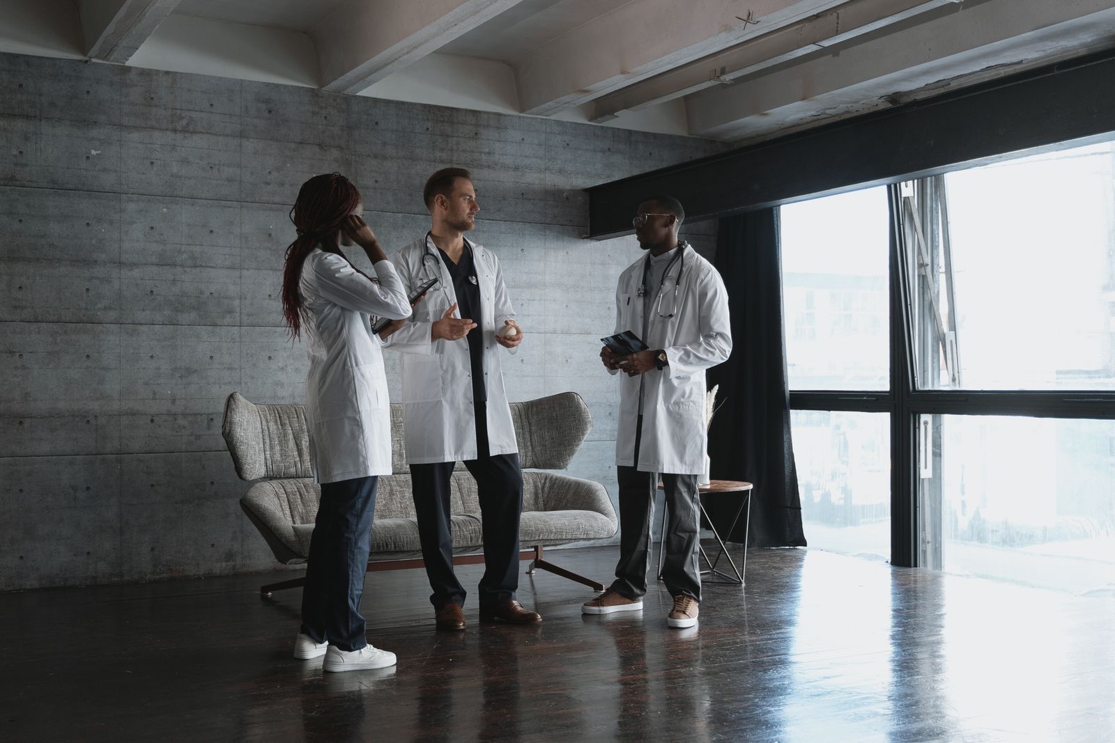 Diverse group of medical professionals discussing patient care