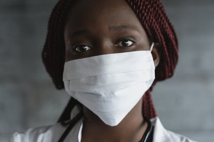 Woman In White Facemask