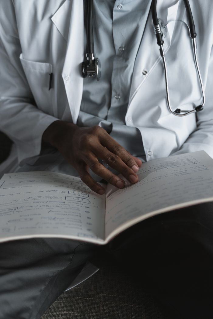 Close-up of a physician reviewing clinical notes