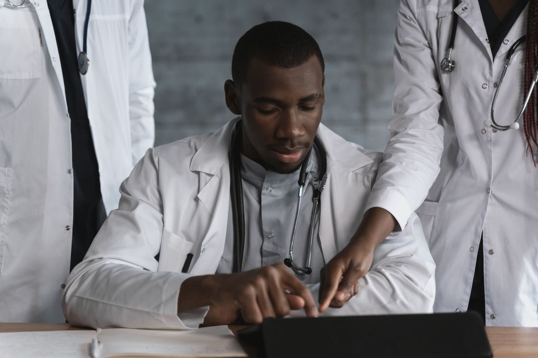 A clinical team reviewing work together