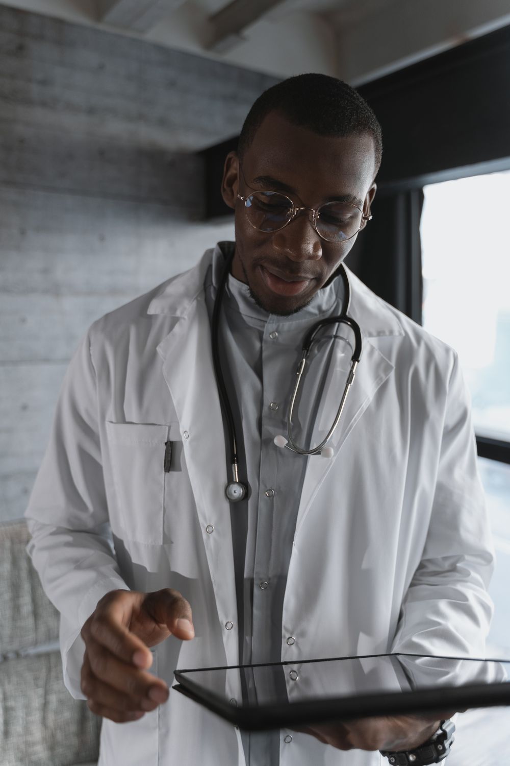 Doctor answering questions during an adult preventive healthcare appointment