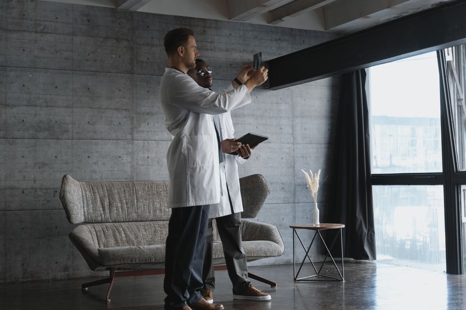 Healthcare professionals collaborating around a digital tablet