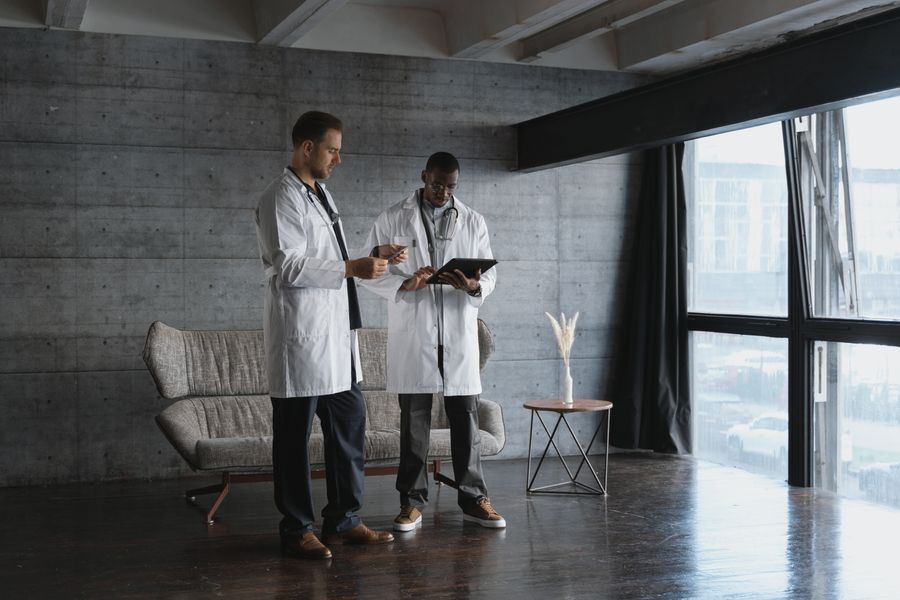 Doctors reviewing patient data on a digital tablet