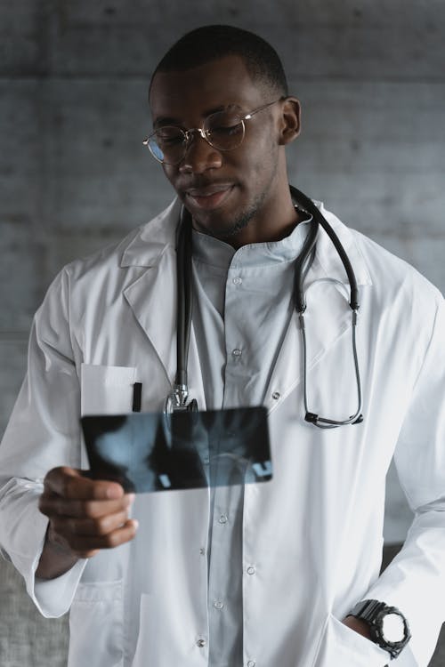 Pensive Doctor looking at an X-ray Result 