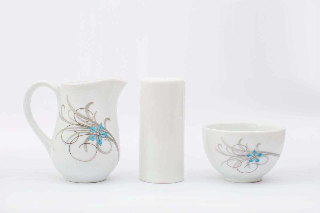 minimalist ceramic tableware including a pitcher and bowl with delicat