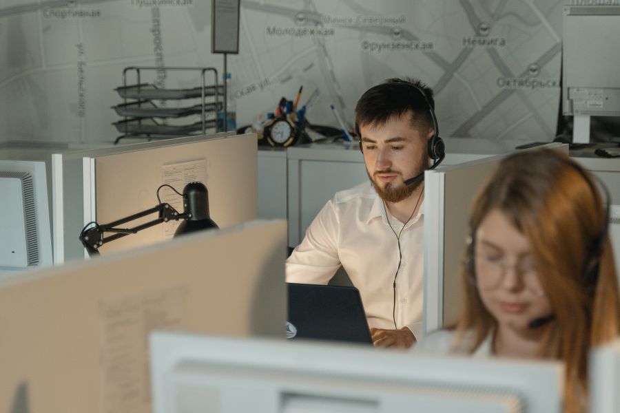 Call centre agents working at desks in a global delivery office